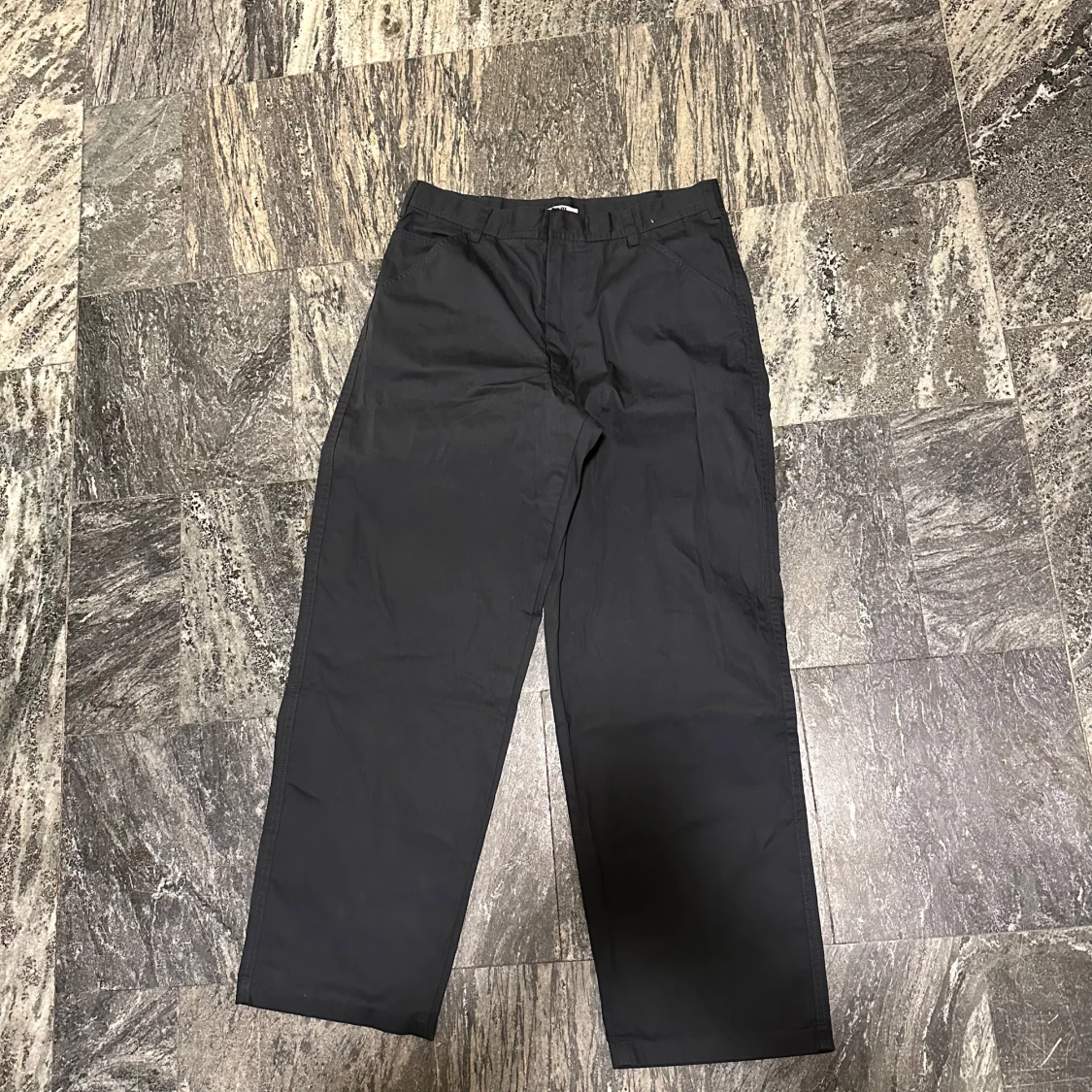 Svarta byxor från Uniqlos U kollektion