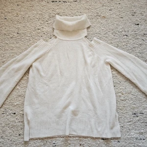 Cream sweater  by River Island - Vintage cream coloured polo neck sweater with cut out shoulders