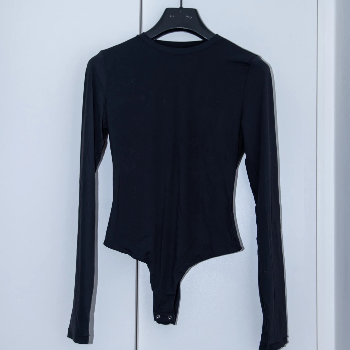 Långärmad ”body hugging” bodysuit