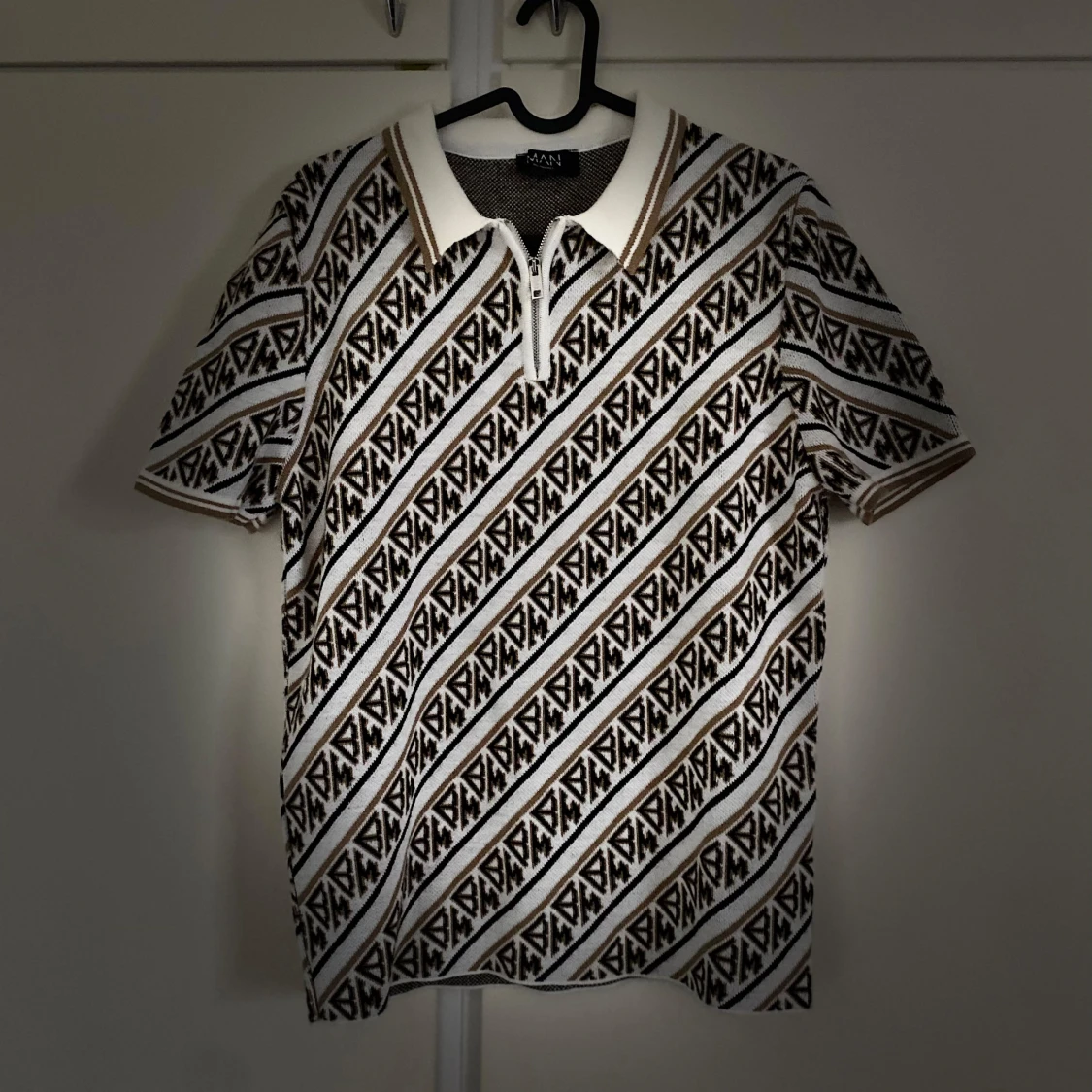 Mönstrad pikétröja med dragkedja - 90