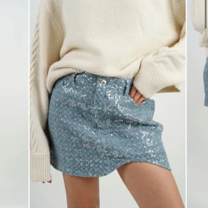 denim kjol med paljetter - Så snygg kjol!!! Slutsåld från märket AVA BE. Ljusblå denim-aktig med massor av silvriga paljetter