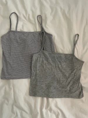 Toppar - Två toppar, en grå och en randig, ganska korta, från Brandy Melville