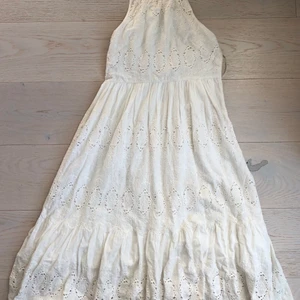White summer dress - Beautiful embroidered white summer dress with halter neckline in great condition. The dress is brand Mauve bought through Anthropologie. Fabric might show slight signs of yellowing.