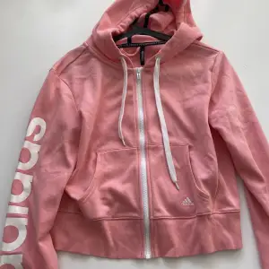 Rosa zip hoodie från adidas med dragkjedja och luva