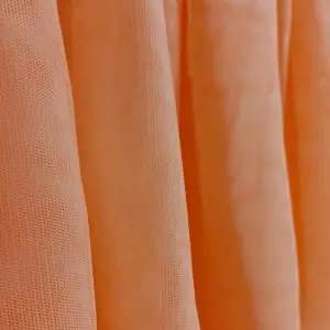 En peachfärgad kjol som funkar perfekt till kalas eller fest. Kan andvändas till både topp och till kjol. 