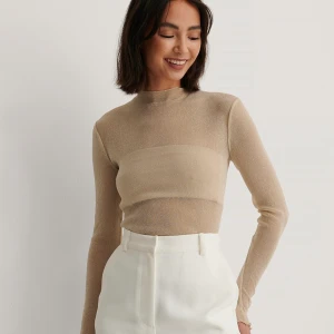 Glittrig topp - Glittrig topp i guld/beige. Storlek s