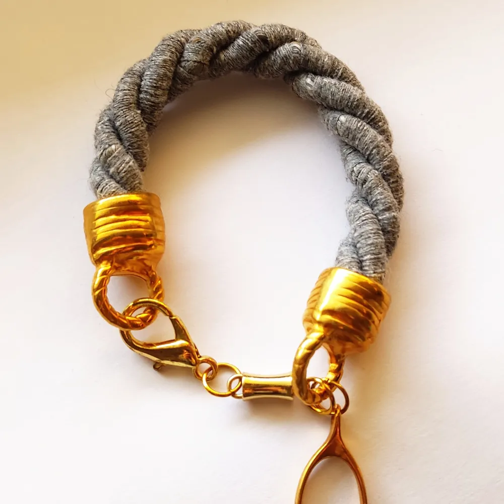Handmade bracelet with the lucky element, grey and gold, new, 22cm length . Accessoarer.
