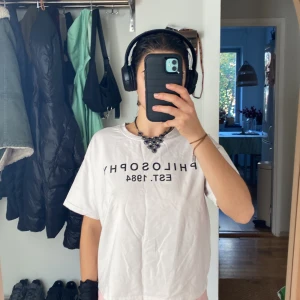 white t-shirt  - philosophy of lorenzo shirt, not original. 