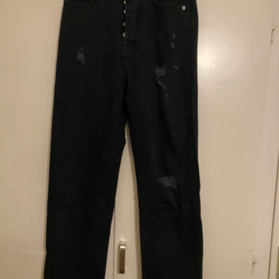 Jeans med slitningar