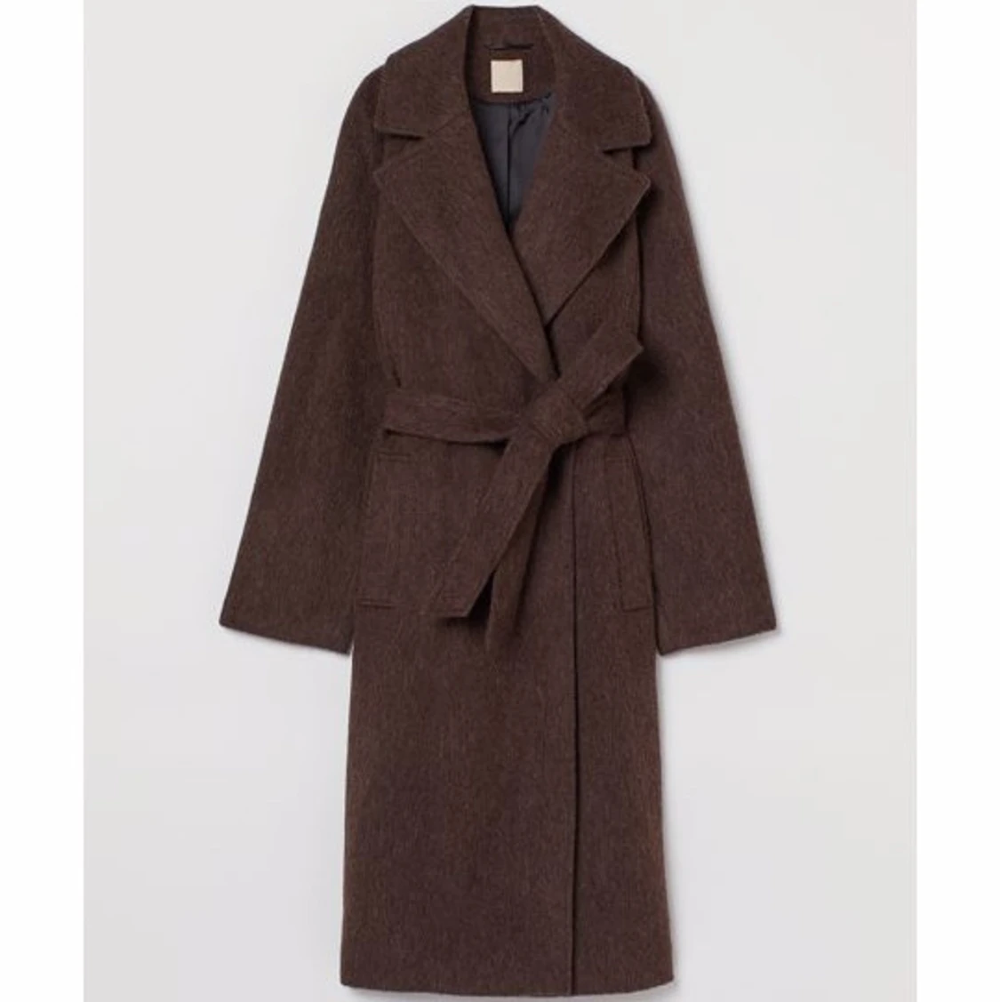 Kappa i trendig brun färg