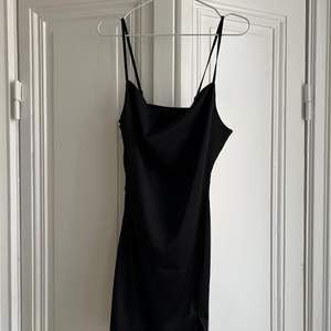The perfect black minidress with slitz. Size small
