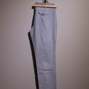 Summer trousers in a blue/white vertical stripe. From Mexx brand, in good condition. 
