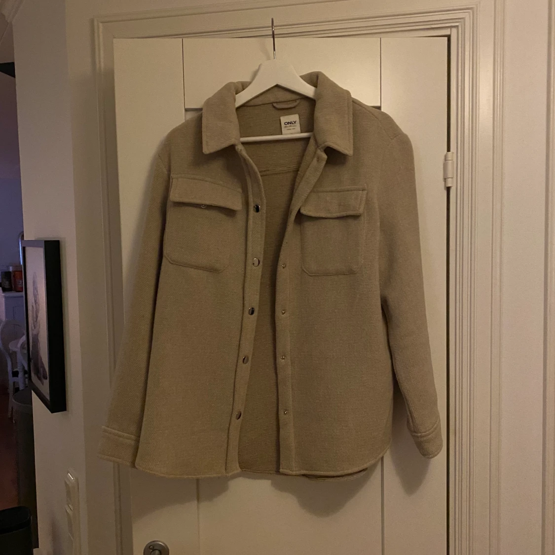 Beige kappa ifrån Only