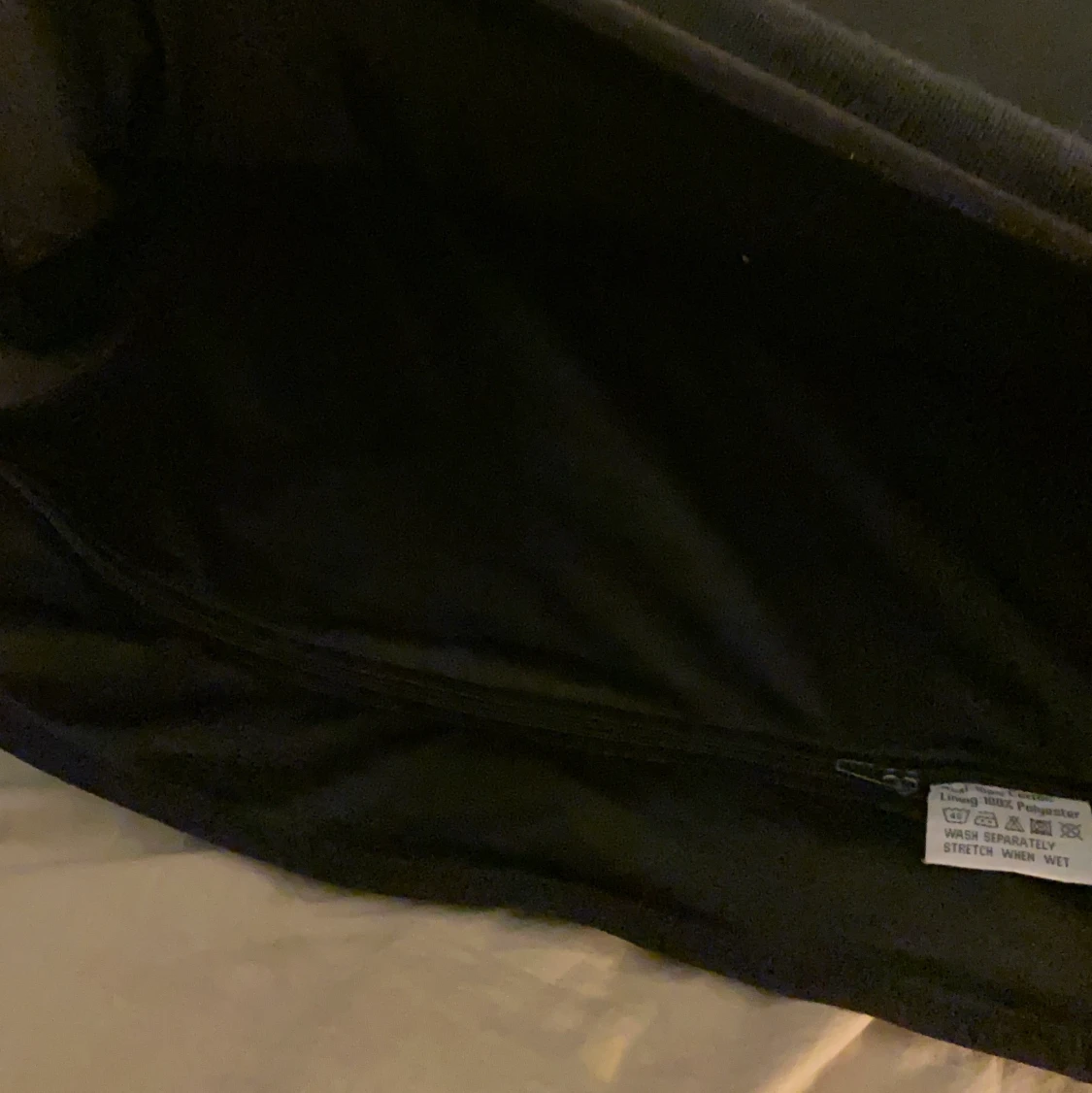 Oversized svart väst med hemligt fack på innersidan  - 90