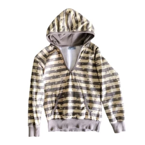 Dödskalle/ mönstrad kofta/ huvtröja/ hoodie, y2k/ cyber/ alt/ 2000s/ 2000tal/ 00s/ 00tal - Super unik vintage kofta med dödskallar på från 2000-talet!! Tröjan är ljusbrun/ljusgul, 100% bomull 