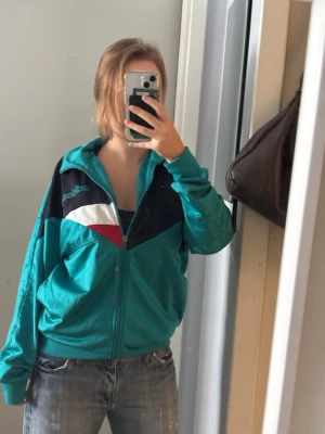 Turkos retro träningsjacka Reebok