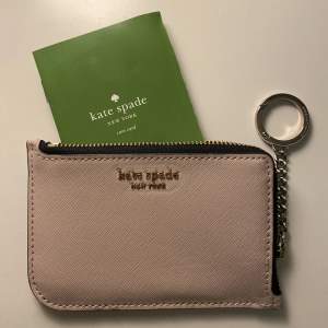 An actual Kate Spade wallet bought from the outlet store in Florida. Cute and practical for everyday use.