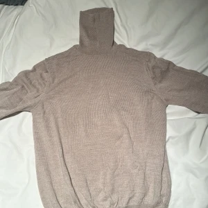 Polotröja - Polotröja i merinoull från Ströms. Sparsamt använd i storlek M.