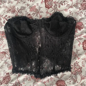 Svart spets korsett - Svart spets korsett, aldrig använt 