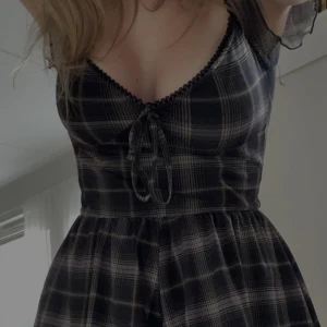 urban outfitters checkered dress                     - only worn once, shorts at bottom not skirt  original price around 400kr