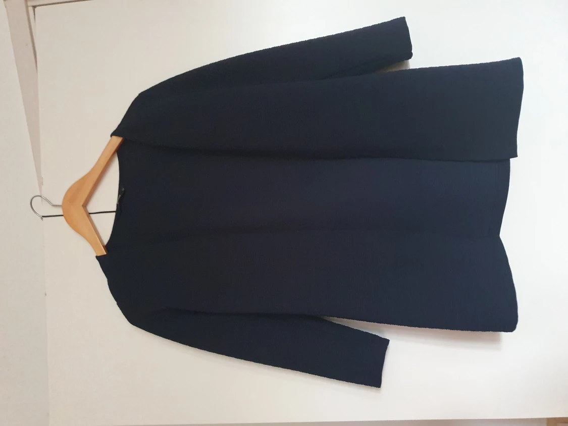 En längre kofta i fint skick.