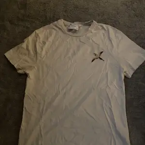 Axel Arigato T-shirt som få gånger varit använd 