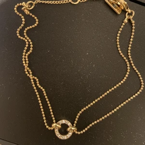 Guldarmband - Två delat guldarmband med ring i mitten! Fint skick! Pilgrim