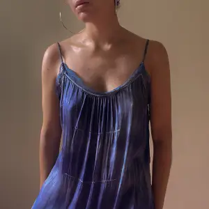 beautiful vintage nightgown  hand dyed blue/purple. some natural discoloration, please appreciate for its character.  lace trim detaile and adjustable strap  100% silk  size medium  very good condition 