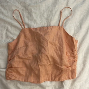 Linne  - Linne i storlek S med knyte på baksidan, ställbara band. Ej använd 