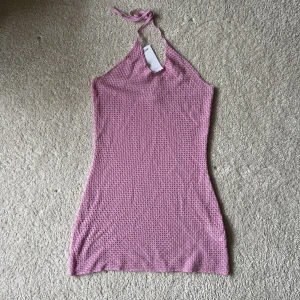 Cover-up - Oanvänd rosa cover-up