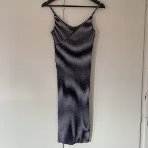 Blue and white striped dress from Topshop in great condition. Dress is in a size EUR 38/ US 6/ UK 10. The dress is tight fitting and great for the summer! 