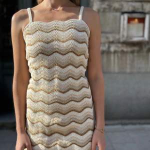 Crochet dress in wavy pattern. Fits XS/S. 