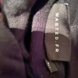 Svart hoodie från märket Wasted Paris 