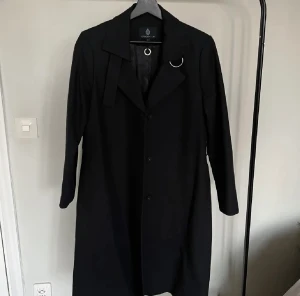 Kappa - Svart kappa i fint skick. Nypris 1000