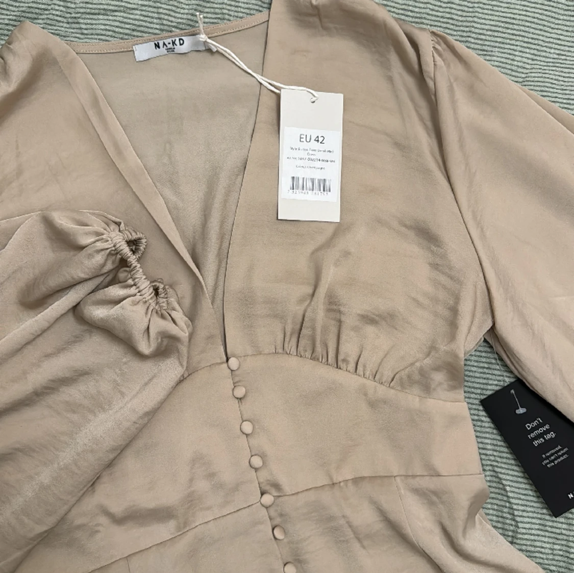 Klänning med knappar - 90