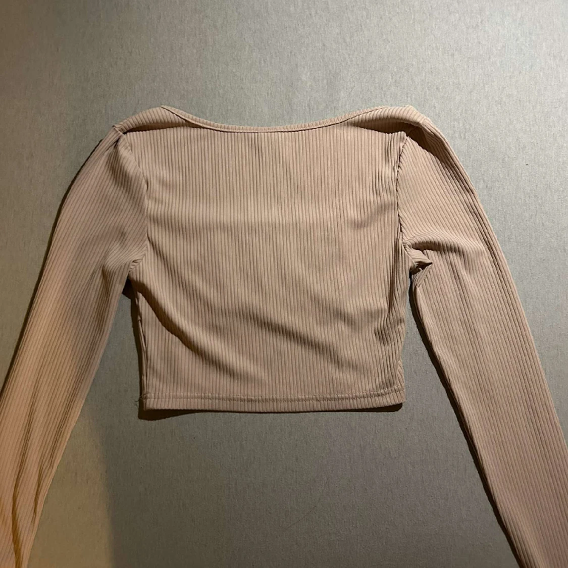 En rosa långärmad tröja  - 90