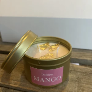 Björn design DOFTLJUS MANGO - doftljus från nystartade Björn design i doften Mango, max koncentration av doft så luktar hela lägenheten. Större modell av ljus. 