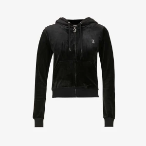 Svart velourjacka från Juicy Couture - Säljer en supermjuk och snygg svart velourjacka från Juicy Couture. Den har en dragkedja framtill och en huva med snörning. På baksidan finns det ikoniska Juicy Couture-loggan i glittriga stenar. 