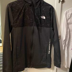 North face kofta storlek s lyser i mörkret med reflexer