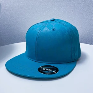 Turkos keps från FSBN - Ny och oanvänd keps från märket FSBN. 