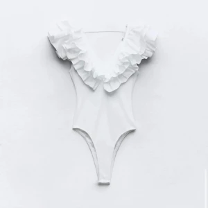 Volangbody - Body med volanger från Zara. Riktigt snygg till kjol eller ett par jeans men kommer tyvärr inte till någon större användning hos mig