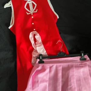 Kyoko Sakura Madoka Magica Cosplay - Only been worn a few times. has been sewn in from an M/L to S/M but can be reversed if needed (i havent cut off the excess fabric). Comes with bow, undershirt, dress, skirt, sleeves. 