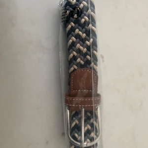 Flätad bälte  - Grisch