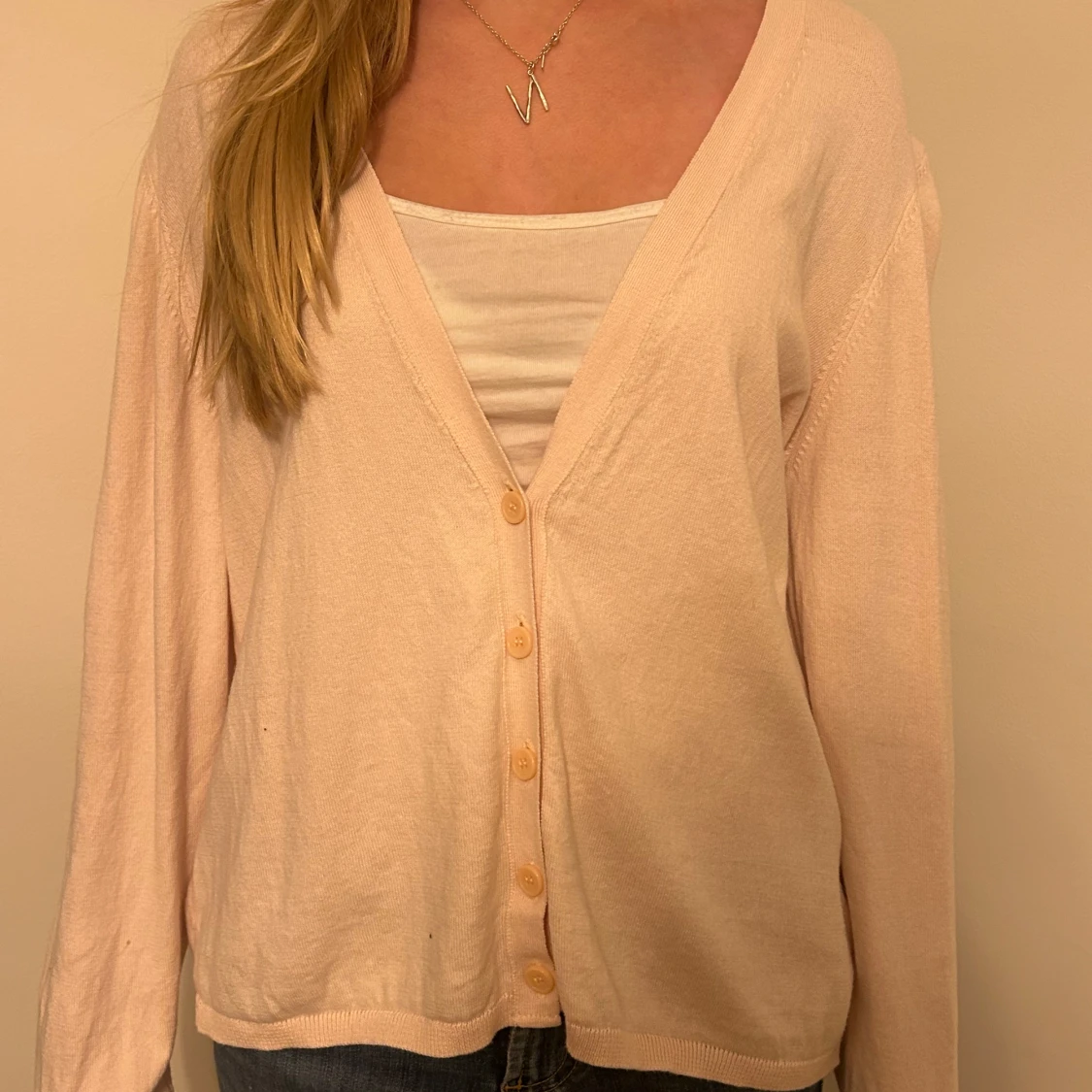 Rosa kofta med knappar