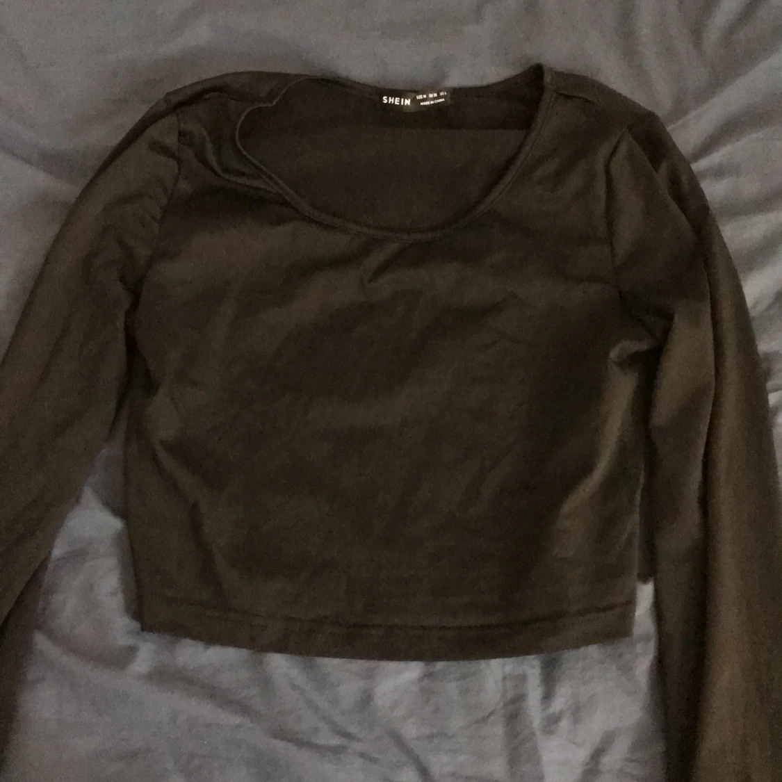 tröja med utspridda armar