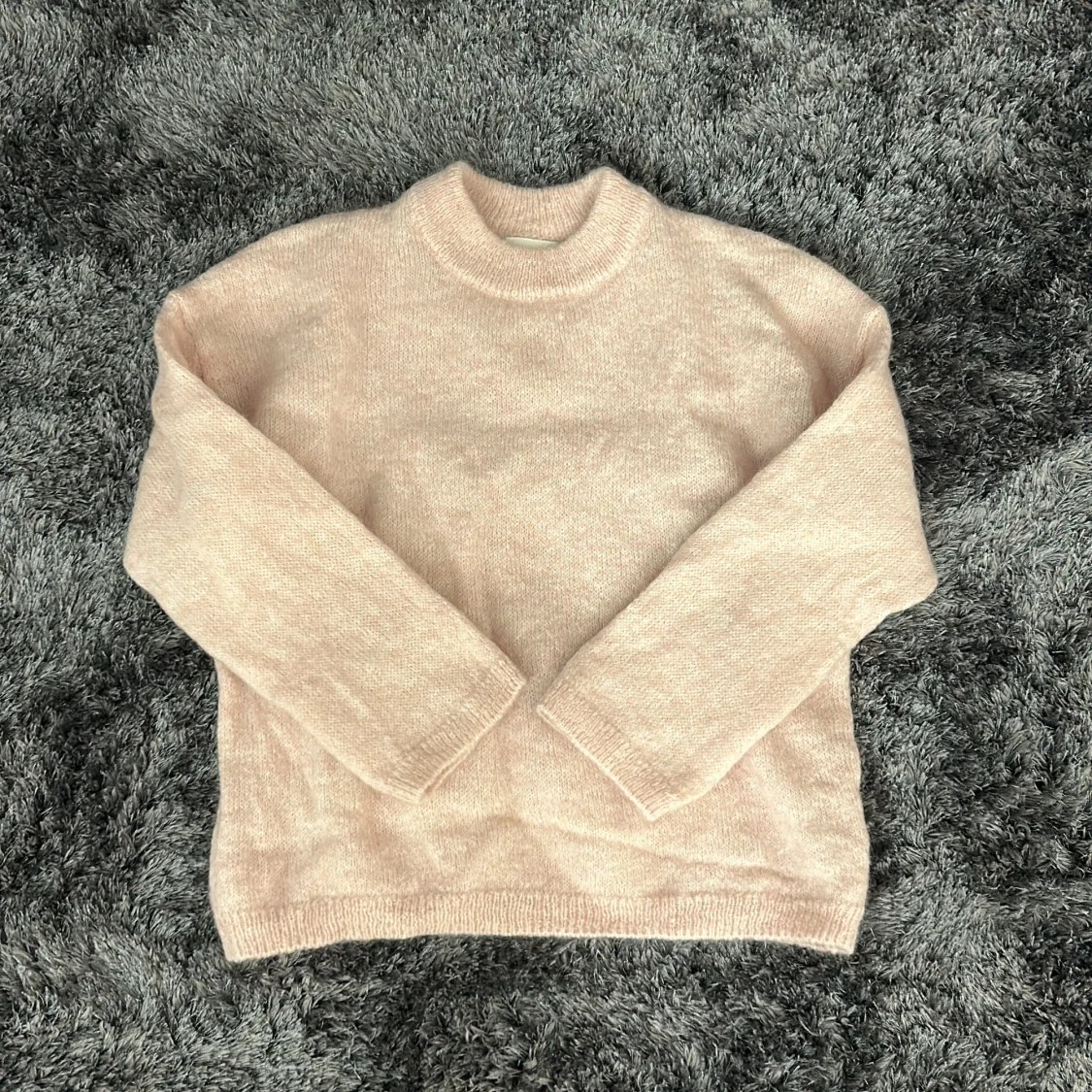 Ljusrosa stickad tröja