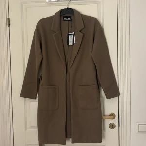 Kappa, pieces  - Brun kappa Storlek Xs Aldrig använd Köptes för 549kr, säljer för 200kr