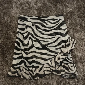 New with tag - Beautiful skirt. Never used, still has a tag on. Perfect with boots and sandals/heels