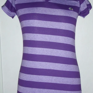 Lacoste - Lacoste helt ny aldrig använd.   Storlek one size (small/medium).   Säljes enligt bilden