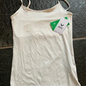 Oanvänt träningslinne - Helt oanvänd eftersom jag inte trivs i vitt